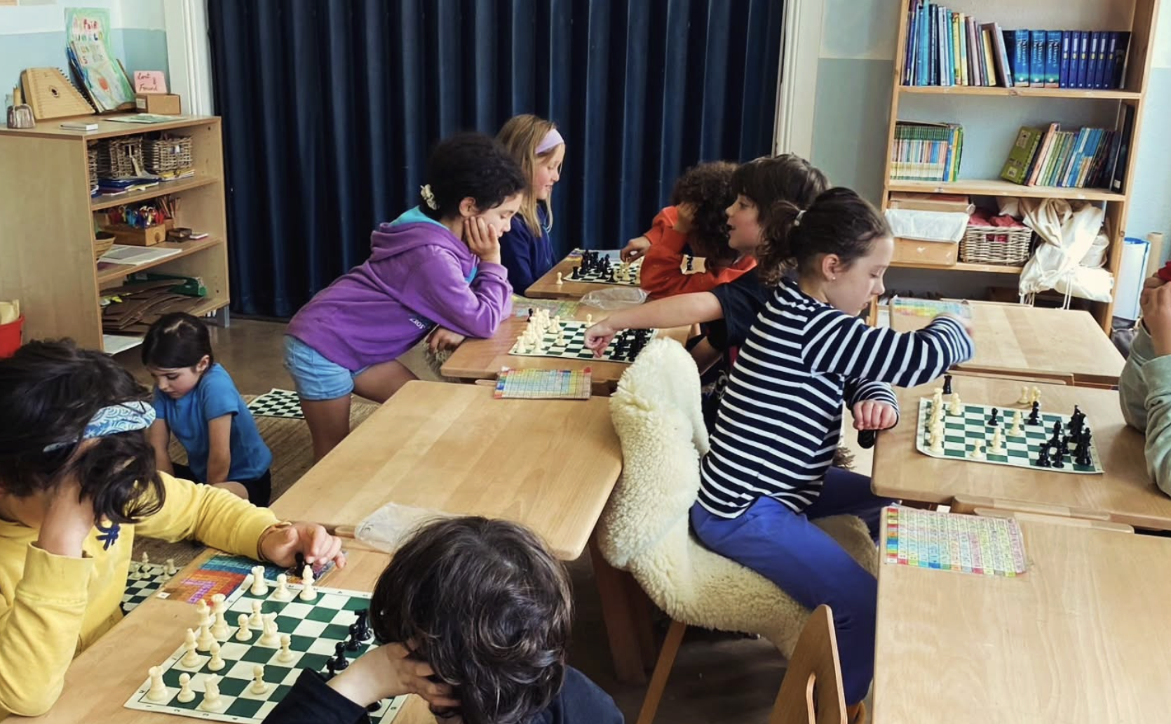 A chess instructor teaching a class