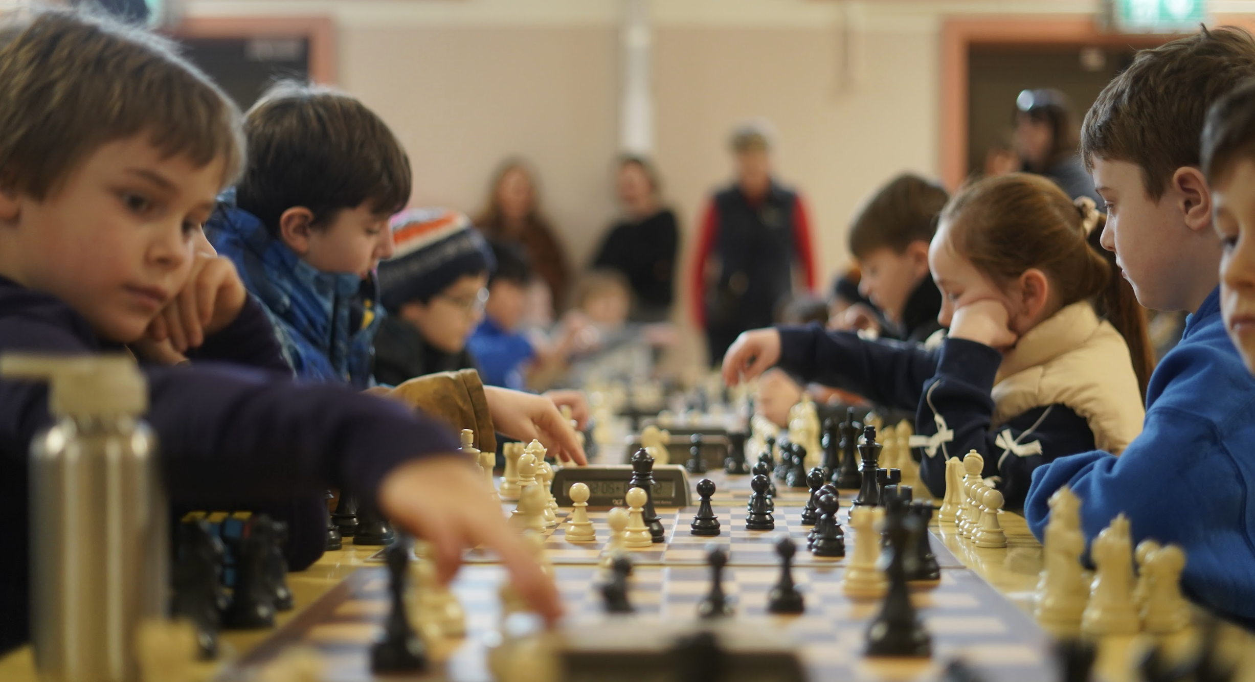 Instructor supervising chess club